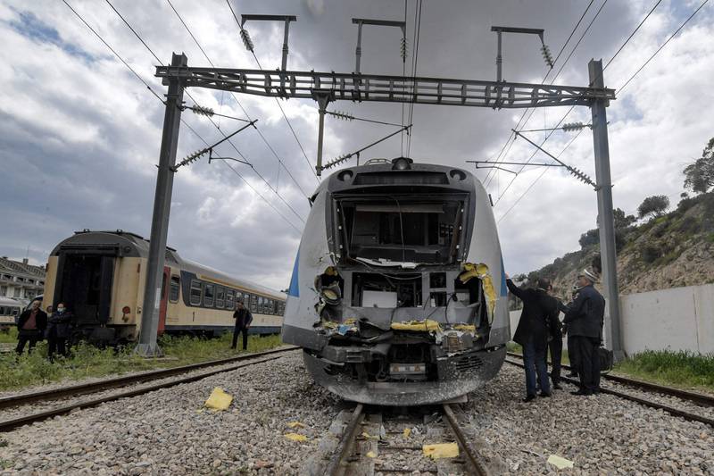 This picture taken on March 21, 2022 shows a view of the scene of a train collision in the Jbel Jelloud area in the south of Tunisia's capital Tunis.  - A collision between two passenger trains early on March 21 injured 95 people in the south of the Tunisian capital, emergency services said.  The cause was not immediately clear.  (Photo by FETHI BELAID  /  AFP)