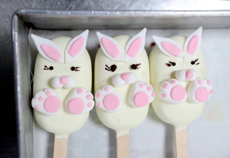 Red velvet spring 'cakesicles' with an Easter bunny theme.