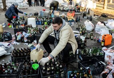 Local residents in Zhytomyr, Ukraine, prepare Molotov cocktails. Reuters