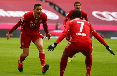 Robert Lewandowski, left, celebrates with Serge Gnabry after scoring Bayern Munich's opening goal in their 4-0 Bundesliga win over Stuttgart at the Allianz Arena on Saturday, March 20. AP