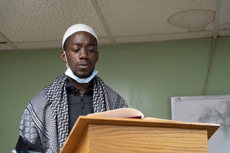 Deonte 'Abu Bakr' Bryant reads from the Quran in the Na'matul Islam Mosque. Willy Lowry / The National