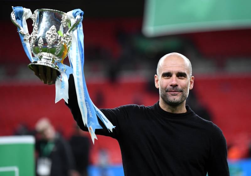 Pep Guardiola celebrates after winning the League Cup in 2020. Getty
