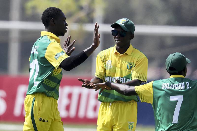 ABU DHABI , UNITED ARAB EMIRATES , October 24  – 2019 :- Sylvester Ameh Okpe of Nigeria ( left ) celebrating after taking the wicket of Chirag Suri during the World Cup T20 Qualifiers between UAE vs Nigeria held at Tolerance Oval cricket ground in Abu Dhabi. UAE won the match by 5 wickets.  ( Pawan Singh / The National )  For Sports. Story by Paul