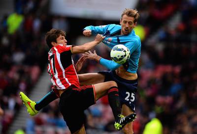 Santiago Vergini of Sunderland tussles with Peter Crouch of Stoke City during their Premier League match on Saturday in Sunderland. Nigel Roddis / Getty Images