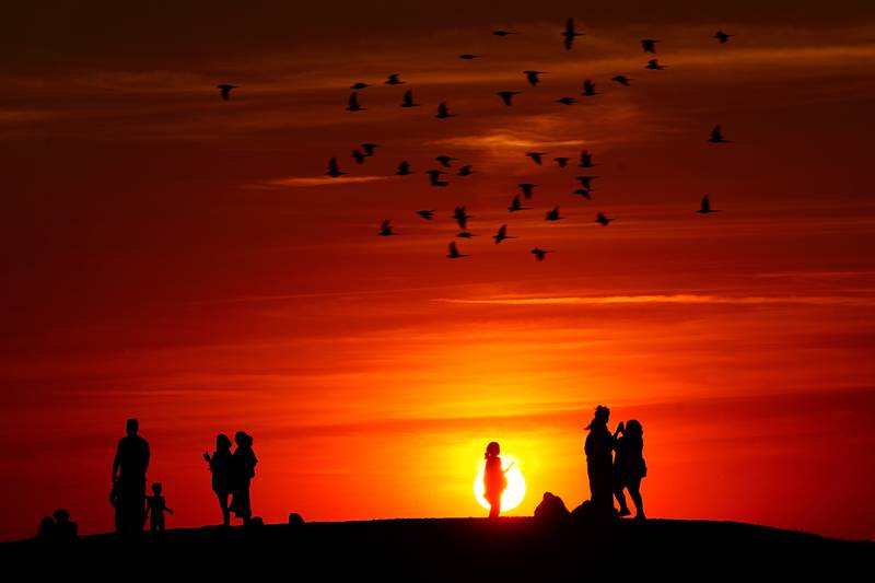Sunset on a hill in Ealing, west London, as a summer of hosepipe bans and fire warnings continues, and a heat health alert in place across much of the country. AP
