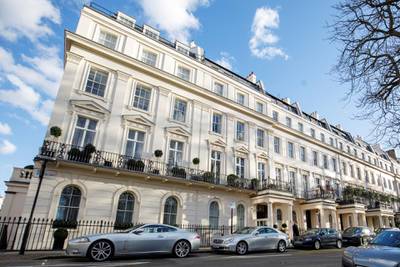 Houses and cars are seen in Eaton Square in Belgravia, London on March 8, 2018. (Photo by Tolga Akmen / AFP)