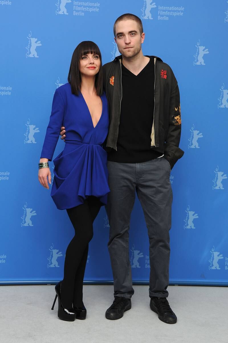 Robert Pattinson, in a bomber jacket and grey trousers, and Christina Ricci attend the 'Bel Ami' photocall during the 62nd Berlin International Film Festival on February 17, 2012. Getty Images