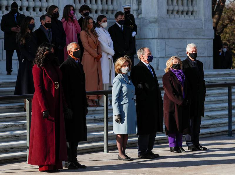 Former President Bill Clinton with his wife, former Secretary of State, Hillary Clinton, former President George W. Bush with his wife Laura Bush, and former president Barack Obama and his wife Michelle Obama at the Arlington National Cemetery. Reuters