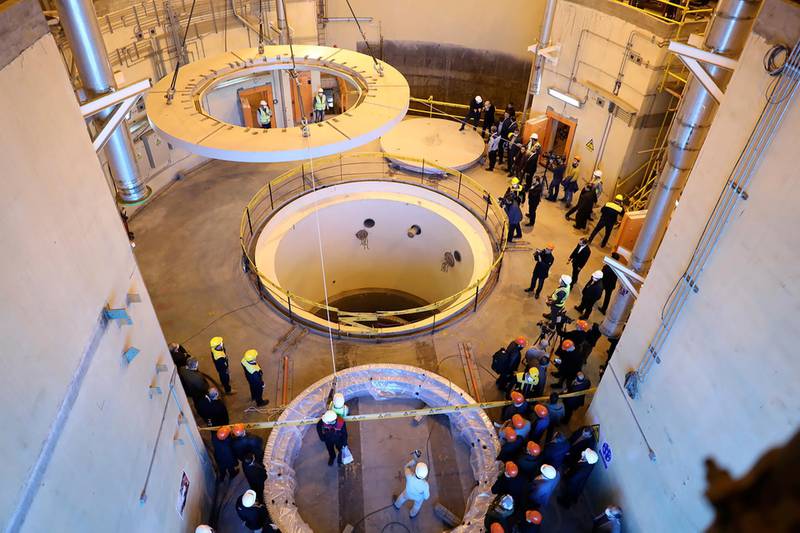 Technicians work at the Arak heavy water reactor's secondary circuit, as officials and media visit the site, near Arak, Iran in 2019. Atomic Energy Organization of Iran via AP