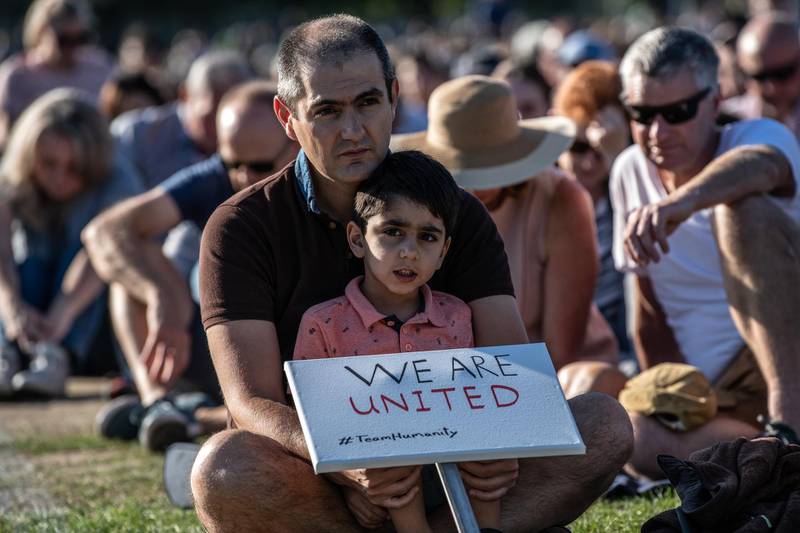 CHRISTCHURCH, NEW ZEALAND - MARCH 24: A young boy holds a placard as he takes part in a vigil to remember the victims of the Christchurch mosque attacks, on March 24, 2019 in Christchurch, New Zealand. 50 people were killed, and dozens were injured in Christchurch on Friday, March 15 when a gunman opened fire at the Al Noor and Linwood mosques. The attack is the worst mass shooting in New Zealand's history.  (Photo by Carl Court/Getty Images)