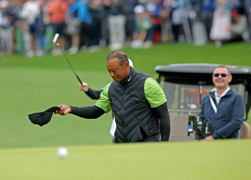Tiger Woods reacts after chipping on to the 12th green for an eagle putt, on the first day of the JP McManus Pro-Am. AFP