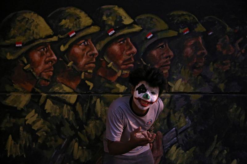 A demonstrator poses for photos during ongoing anti-government protests, in Baghdad. Reuters