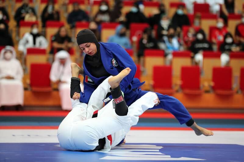 Balqees Abdulla of Palm Sports Team 777, right, takes on Shamma Al Blooshi of Sharjah Self Defence Sports Club in the bronze medal match.