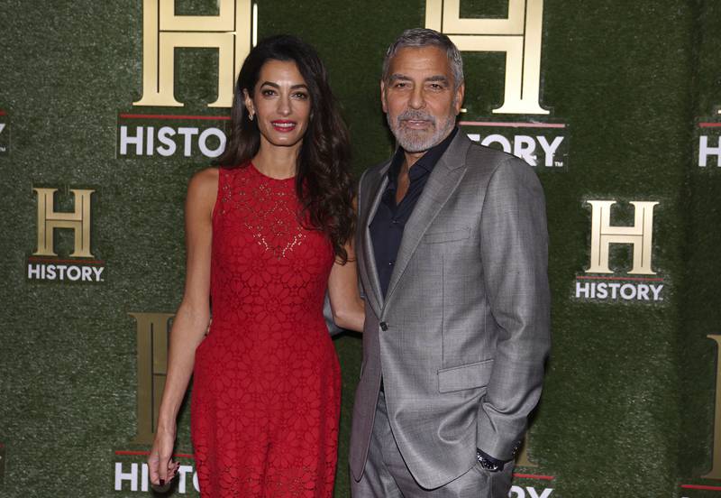 Human rights lawyer Amal Clooney and actor husband George Clooney arrive at HistoryTalks in Washington. 
