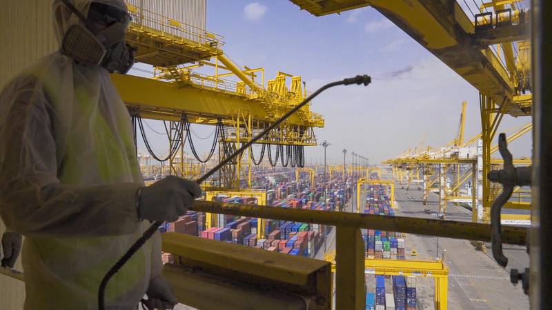  An employee sanitises a piece of equipment at DP World's Jebel Ali port. Courtesy DP World