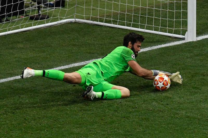Alisson makes a save during the final against Tottenham. AFP