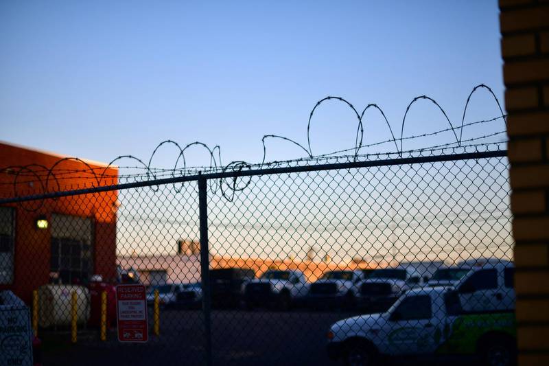 Barbed wire stretches across the fence at Four Seasons Landscaping. Reuters