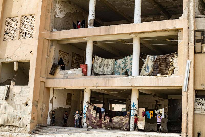 A view of a damaged building housing internally displaced Syrians from Deir Ezzor in Syria's northern city of Raqqa.