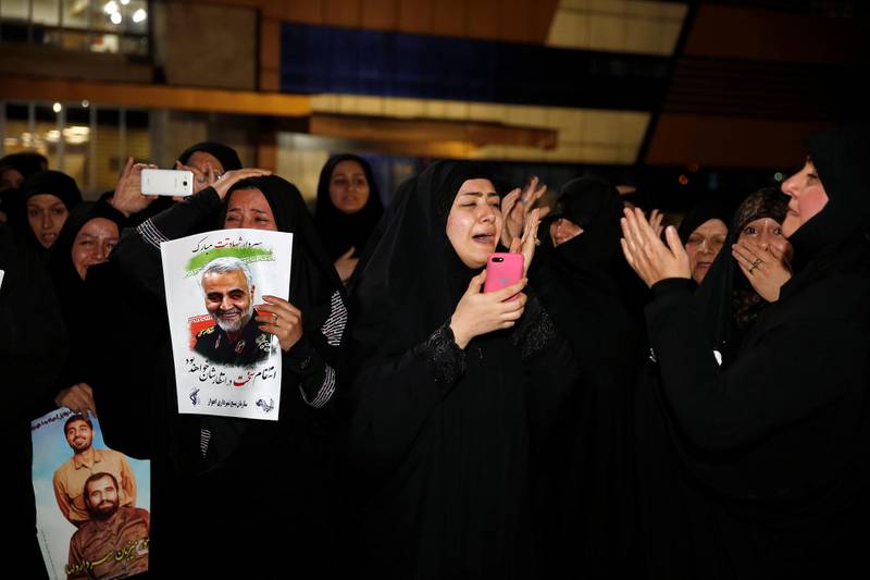 Iranian mourners react upon the arrival of bodies of the Iranian Major-General Qassem Suleimani, head of the elite Quds Force, and the Iraqi militia commander Abu Mahdi Al Muhandis, who were killed in an air strike at Baghdad airport, at Ahvaz international airport, in Ahvaz, Iran. Reuters