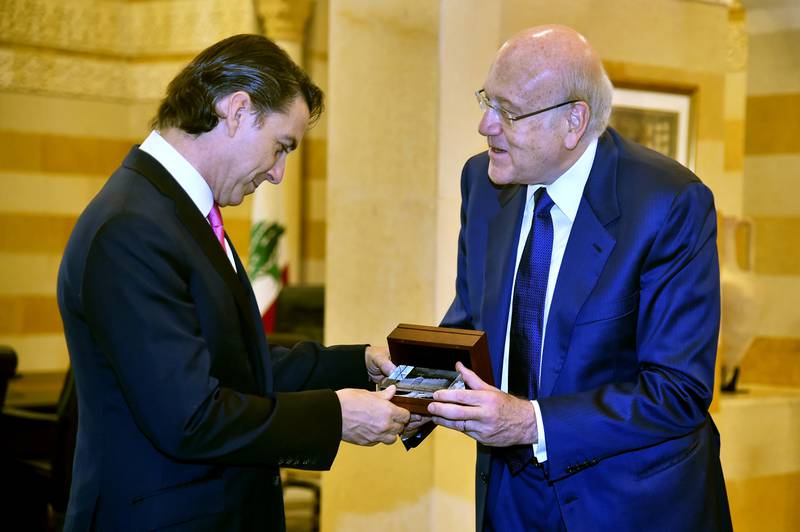 Lebanese Prime Minister Najib Mikati, right, presents a gift to US Envoy for Energy Affairs Amos Hochstein in Beirut. AP