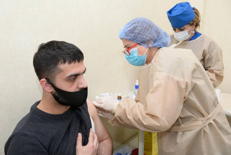 A man receives a dose of Sinovac vaccine against the Covid-19 at a clinic in Baku as Azerbaijan starts its vaccination program. AFP