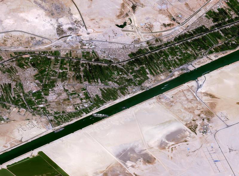 Satellite image shows the Suez Canal, a global trade way, blocked by the Ever Given vessel. Airbus Space 
