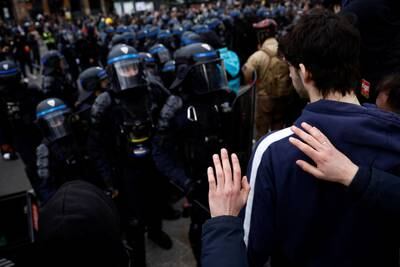 Protesters face off with riot police. Reuters