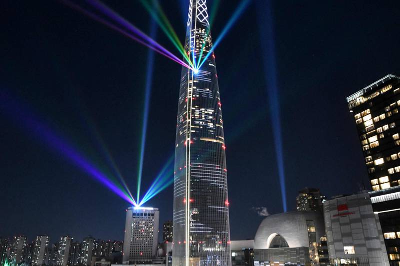 Beams of light are projected from the 123-storey Lotte World Tower during a countdown to the New Year in Seoul, South Korea. AFP