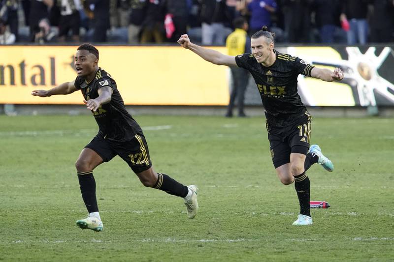Los Angeles FC defender Diego Palacios and Gareth Bale  celebrate after defeating the Philadelphia Union in a  penalty shootout to win the MLS Cup. AP