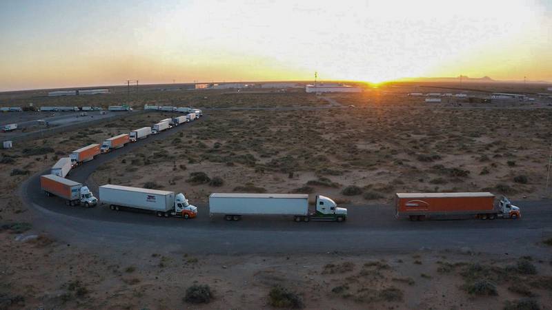 Truckers block the entrance into the Santa Teresa Port of Entry in Ciudad Juarez going into New Mexico on April 12, 2022.  The truckers blocked the port as a protest to the prolonged processing times implemented by Gov.  Abbott which they say have increased from 2-3 hours up to 14 hours in the last few days.  (Omar Ornelas  / The El Paso Times via AP)