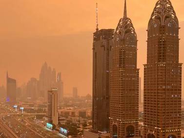 Dubai skyline disappears in cloud of orange dust 