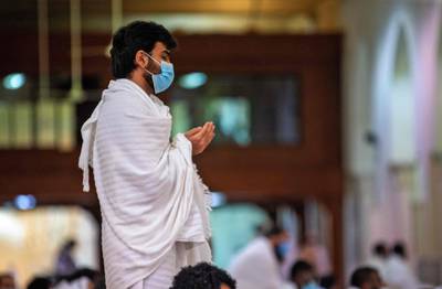 A pilgrim attends prayers. AFP