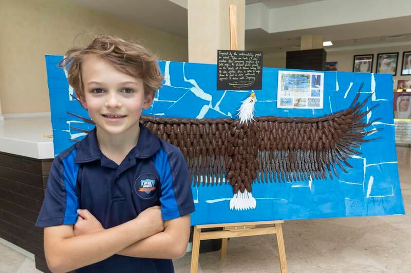 Tyler Smith, 7, a pupil at RAK Academy British School Al Hamra, created a sculpture out of plastic and other litter he found on the beach. It is now on display in his school lobby. Antonie Robertson / The National
