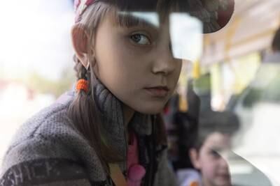 A Ukrainian girl with other civilians on a bus as they flee the violence in Slovyansk, in the Donetsk region. Reuters