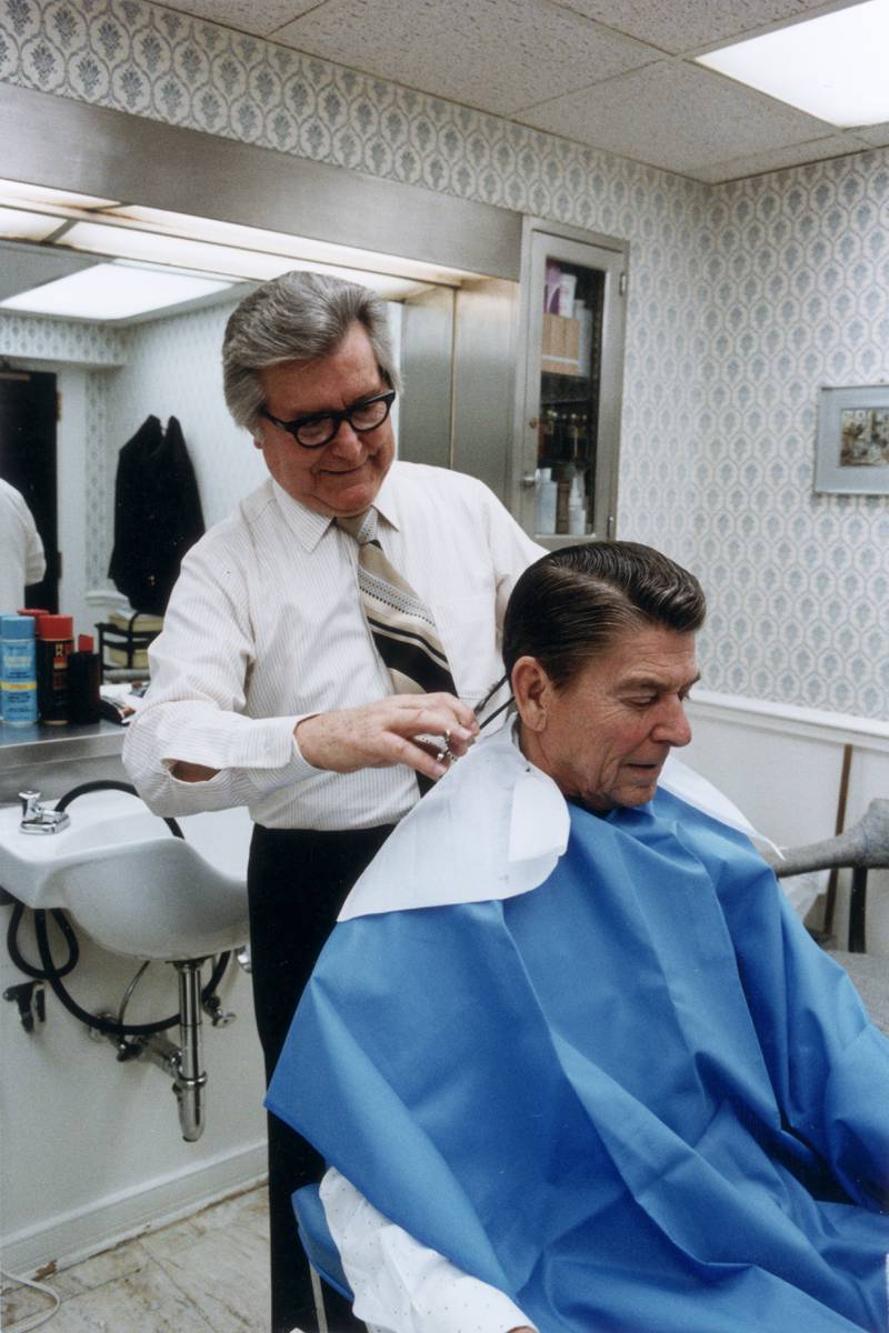 US president Ronald Reagan gets his hair trimmed in the White House, in January 1981. Getty Images