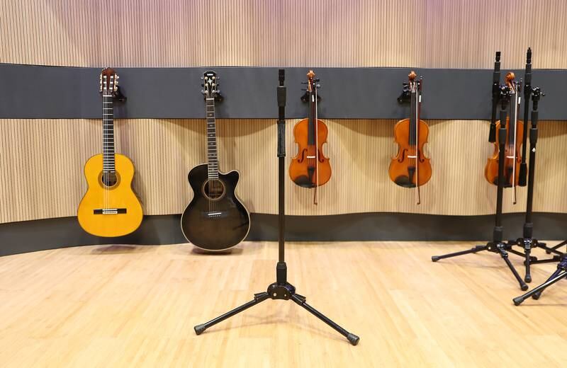 A suite of instruments from guitars and violins to flutes,  grand pianos and the harp are available for musicians at the Firdaus studio by A R Rahman at Expo City Dubai. Pawan Singh / The National