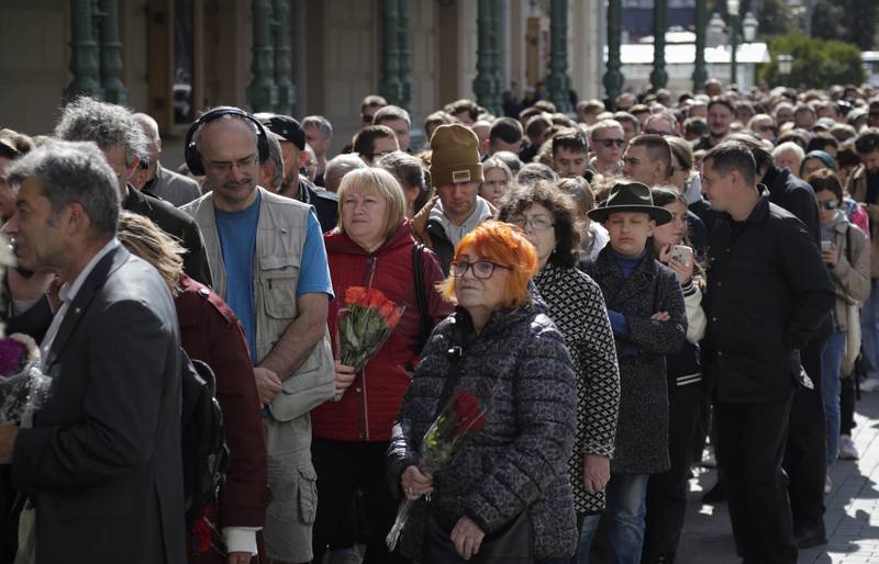 People queue outside the hall near the Kremlin. AP 