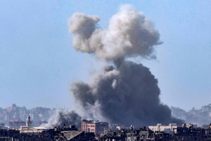 Smoke rises from an Israeli strike in the Gaza Strip. which has been under relentless bombardment. AFP