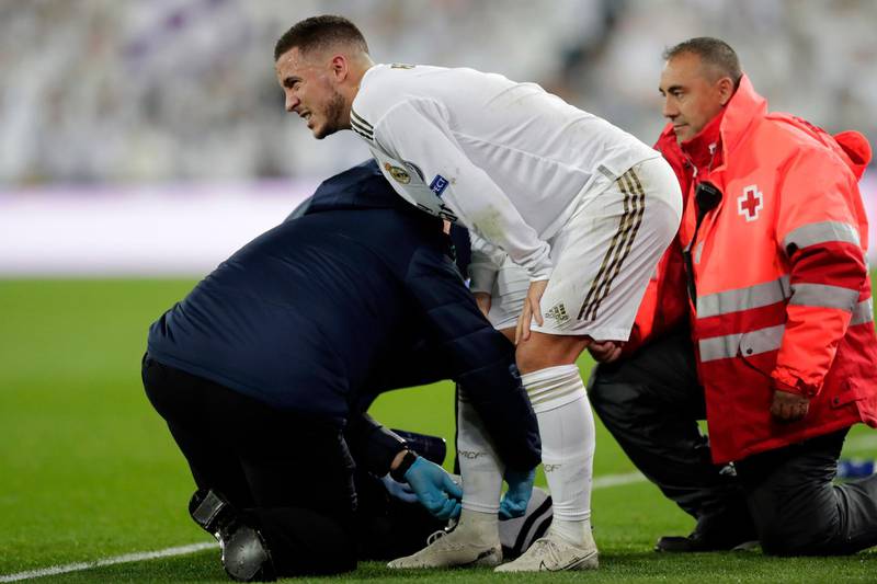 Real Madrid's Eden Hazard is injured during the Champions League match against Paris Saint Germain at the Bernabeu. AP
