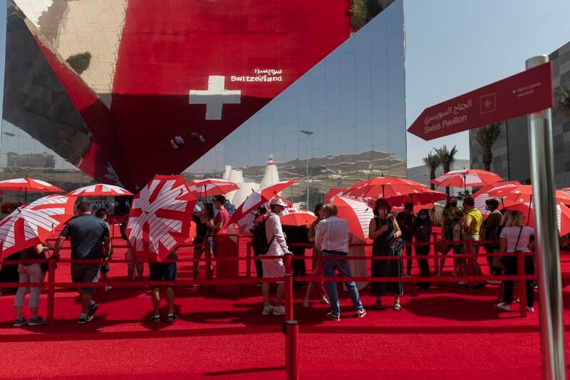 In addition to a spectacular design, the umbrellas offered to queuing visitors to shield them from the sun also helped make the Switzerland pavilion a popular draw. Antonie Robertson / The National