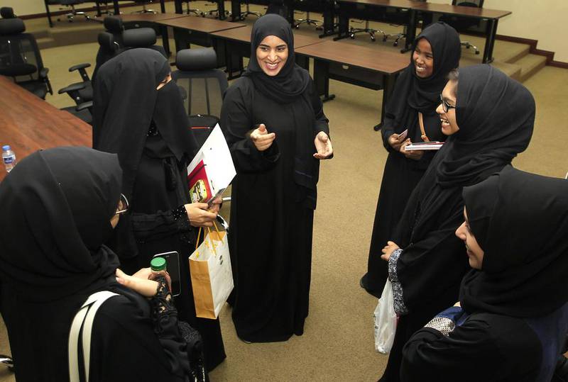 From left, Maram Khalid, Zinab Abdullah, Air Force pilot Fatima Al Mansoori, Rehab Mussa, Safwa Akber and Fatima Al Hashemi are in the third and fourth years of the aviation programme at Abu Dhabi University. Jeffrey E Biteng / The National