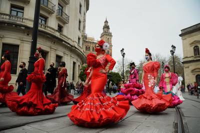 Women wearing flamenco dresses protest in Seville, Spain, to highlight the difficulties the flamenco fashion sector is facing over coronavirus restrictions. AFP