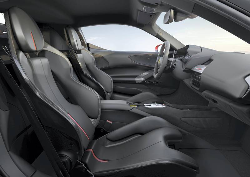 Inside, the interior takes on a futuristic approach with a strong focus on a new 16-inch high-res LCD wrap-around instrument binnacle that is a first for production cars. Courtesy Ferrari