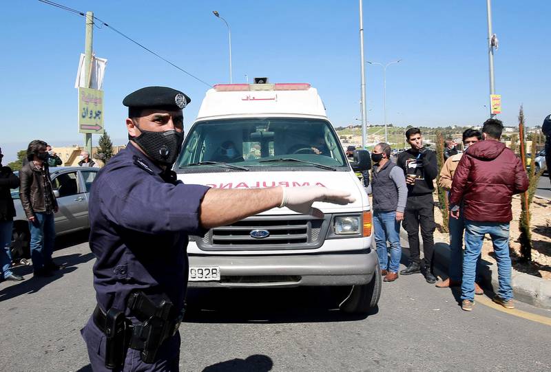An ambulance leaves Al-Hussein Al Salt Hospital in Salt. AP Photo