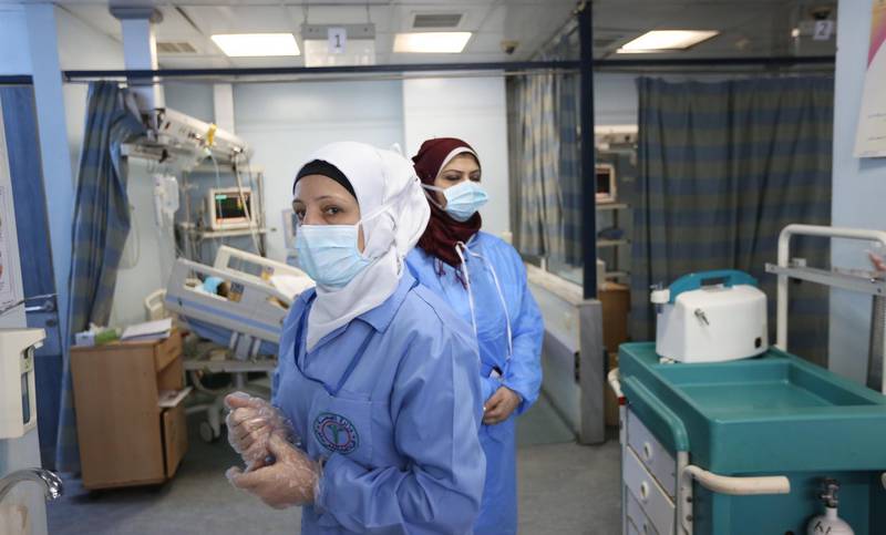 Nurses work in the intensive care unit at the government-run Al Mojtahed hospital in Damascus, Syria, on March 19, 2020. EPA