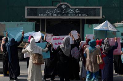 Afghan women hold placards as they take part in a protest in front of the Iranian embassy in Kabul. AFP