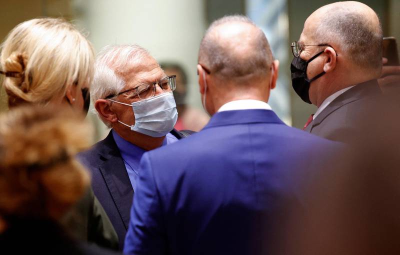 European Union foreign policy chief Josep Borrell (C) speaks with Croatia's Foreign Minister Gordan Grlic Radman (2ndR) and Portugal's Foreign Minister Augusto Santos Silva (R) during a meeting of EU foreign ministers at the European Council building in Brussels, on May 10, 2021. EU Foreign Affairs Ministers meet in Brussels to discuss current affairs, tensions with Russia, the Western Balkans, transatlantic relations and Belarus. / AFP / POOL / Olivier Matthys
