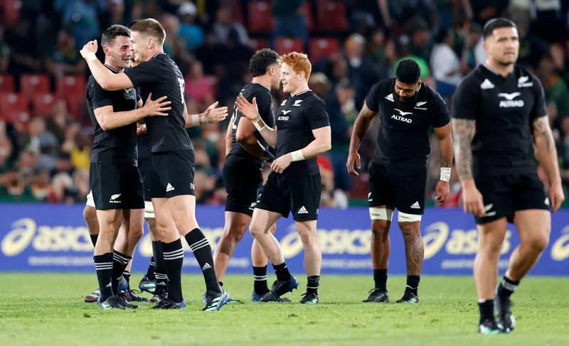 New Zealand players celebrate after their victory against South Africa. AFP