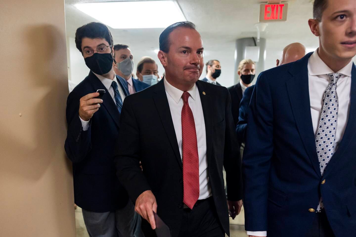 Mike Lee, a senator from Utah, walks to the Senate floor after threatening to force a government shutdown to block President Biden's vaccine mandate. EPA