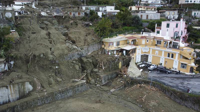 Damaged houses after heavy rainfall triggered landslides that collapsed buildings and left as many as 12 people missing on the Italian island of Ischia. AP